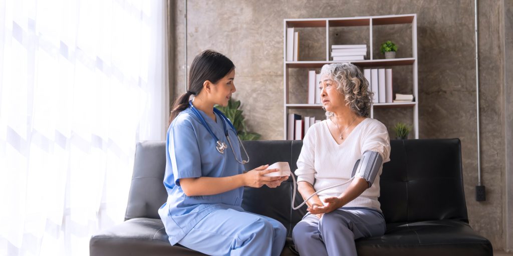 nurse checking on resident
