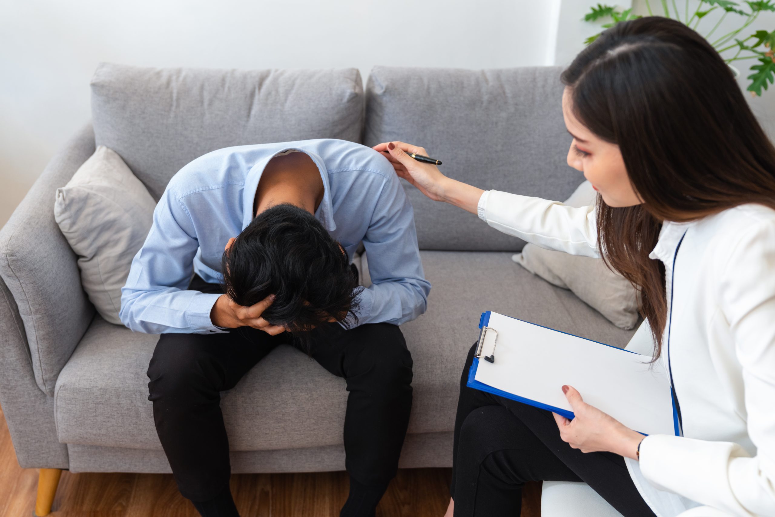 Stressed asian young man patient have life problem sitting on so